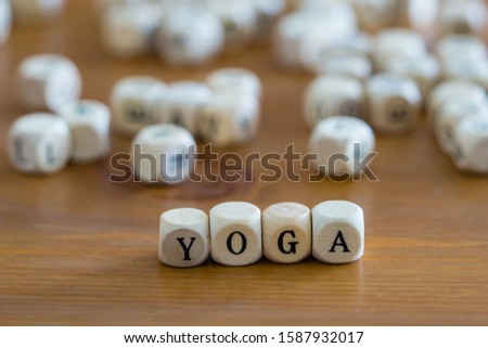 yoga written with wooden cubes