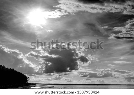 Black and white photo of sunny sky with cloud
