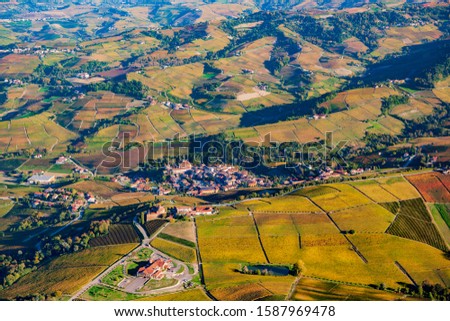
Spectacular spring aerial view of the Piedmontese Langhe, Unesco heritage site, with its famous vineyards, producers of fine Barolo wine. In the center the ancient village of Barolo