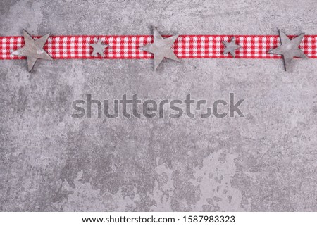 Christmas background, stars on a grey structured background