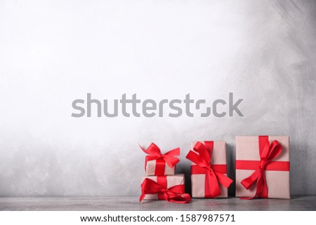 
Greeting card Valentine's day or New Year with  gifts on wooden background. With space for your text greetings