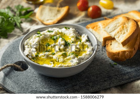 Homemade Herby Goat Cheese Dip with Toast and Tomato Royalty-Free Stock Photo #1588006279