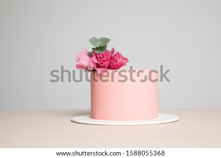 Pink cake on the plate Royalty-Free Stock Photo #1588055368