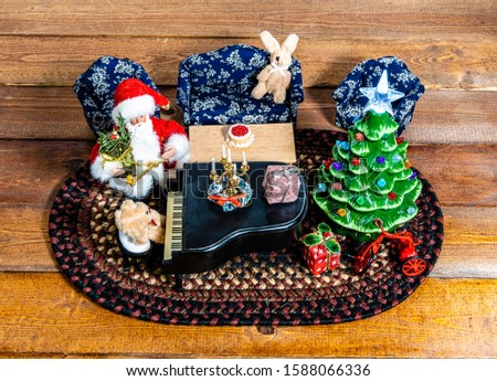 Top down Christmas scene Santa and bear playing piano