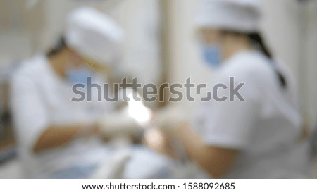 blur  background. in the dentist office . doctor and nurse at work.