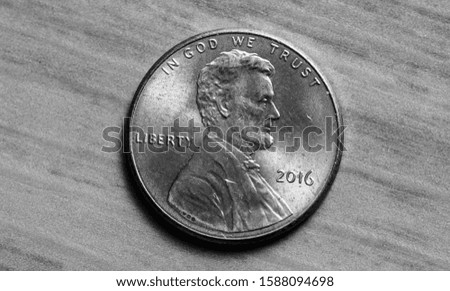 Photo of the back of the dollar penny.

