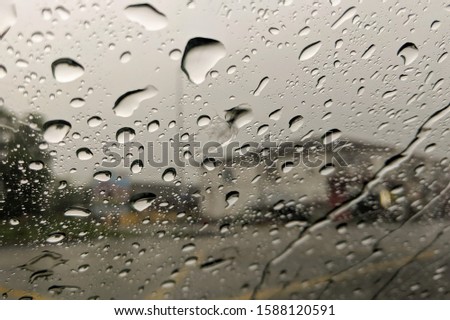 An heavy raining. The road are wet. To be safe, slowly and carefully on driving. Selective focus.