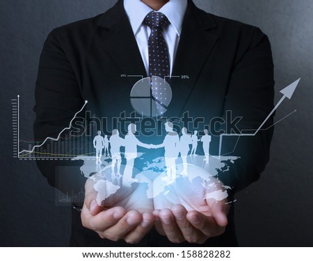businessman with financial symbols coming from hand  Royalty-Free Stock Photo #158828282
