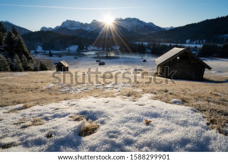Lake geroldsee near garmisch-partenkirchen and Krün in south germany bavaria at sunrise in the winter. Relaxing morning walk with clear sky
