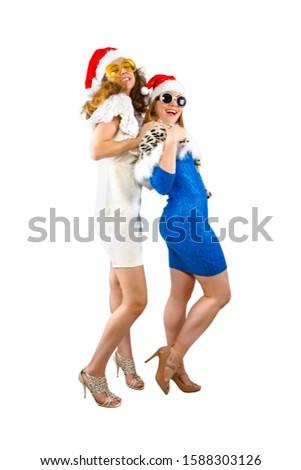 Happy laughing women in Santa hats having fun isolated on white backdrop Happy New Year 2020 celebration holiday concept. Mock up copy space.