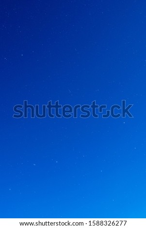Ursa Major on blue sky during full moon lightning up the sky