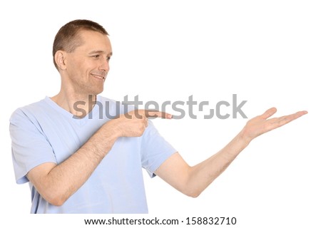 Smiling happy man pointing on white background