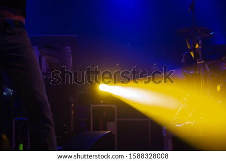 band on stage light show with colorful effects