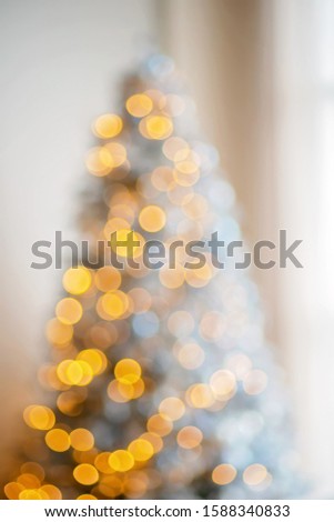 festive interior of a family living room. Christmas tree with garlands elegant holiday. Background of a happy new year and the atmosphere of comfort.