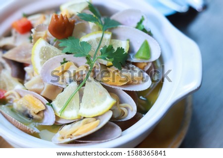 A simple yet classic Japanese clear soup of short-neck clams is not only delicious but is easy to make with very few ingredients.  Royalty-Free Stock Photo #1588365841