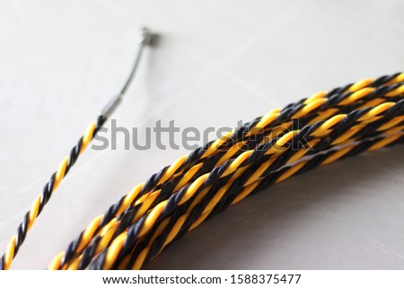 FISH TAPE FOR WIRE PULLING Royalty-Free Stock Photo #1588375477
