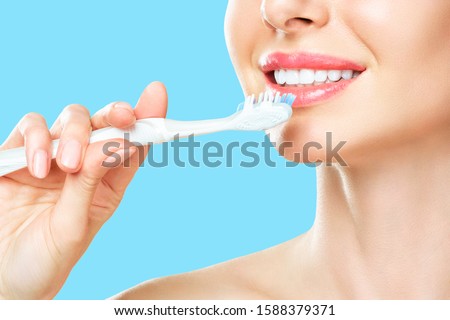 White Teeth with toothbrush. Dental health background.