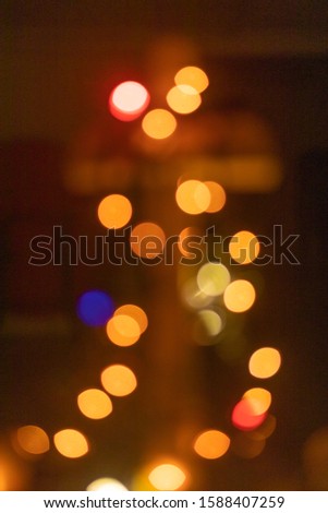 Abstract festive bokeh background with blurred Christmas lights 