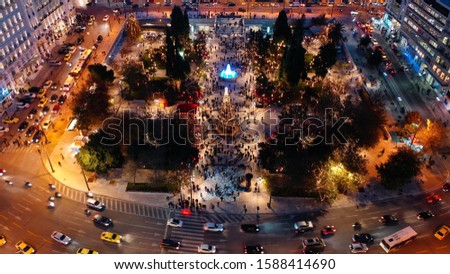 Aerial drone photo of illuminated festive Syntagma square featuring Greek Parliament and Christmas tree, Athens centre, Attica, Greece