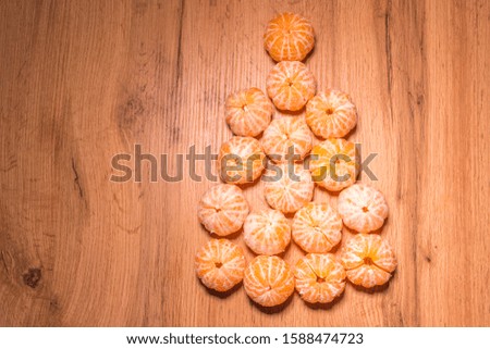 Christmas tree of tangerines, background and texture for Christmas