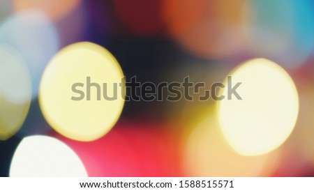 Abstract blurred background with colorful big bokeh defocused lights represent entertainment content, season’s greetings, holiday celebrations theme. (space for text design)
