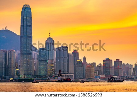 Hong Kong, China cityscape on Victoria Harbor at dusk.