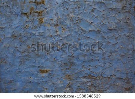 Blue Grunge wall of the old house. Textured background. Cracked concrete vintage wall background, old wall painted blue. 