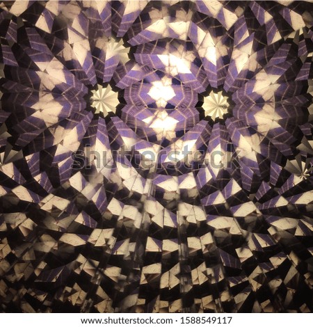 Abstract background. Main colors:purple, beige and black. Real shooting done with a kaleidoscope
