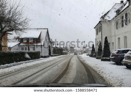 Street of a small town in snowfall