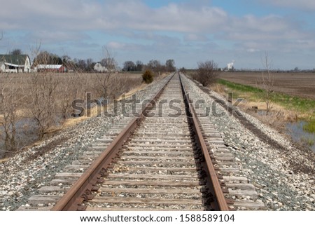 View of railroad tracks in the countryside. Path ahead or journey concept.