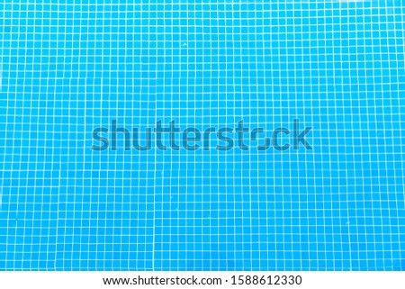 Blue pool bottom with sun highlights 