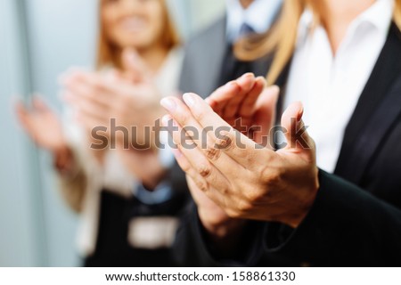 Close-up of business people clapping hands. Business seminar concept Royalty-Free Stock Photo #158861330