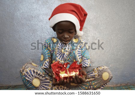 Handsome Baby Boy Opening Gift for Christmas              