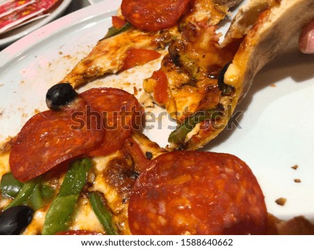 Pepperoni pizza slices on plate. Studio Photo