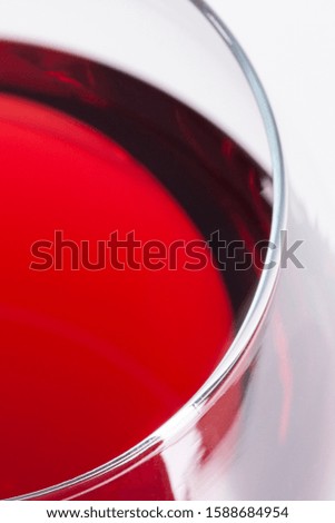 Red wine in glass, viewed from the top corner. Close-up