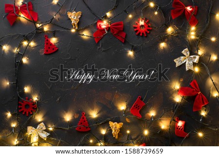 New Year's Eve inscription among Christmas toys and lights