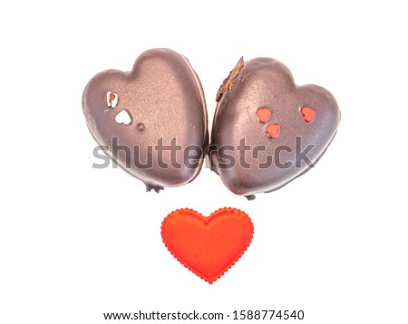 Chocolate heart on a white background with place for text for Valentine's Day. Food photo. Dessert. Present. Background image. Celebration. Congratulation.