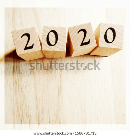 2020 Text New Year Card Template On Wooden Cubes On Wooden Background