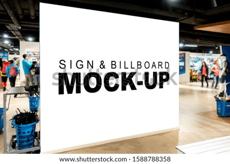Mock up perspective large blank vertical billboard with clipping path on walkway of subway, blurred many people walking, empty space for advertising or information, advertising concept
