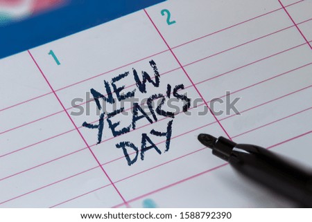 New Year's Day on a calendar with with a highlighter. January 1.