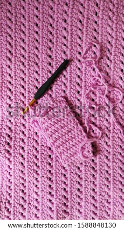 This picture was focused on an unfinished of back loop crochet stitches was on a big crossing double crochet stitch blanket. 