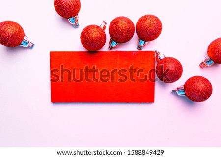 banner on pink background surrounded by red balloons