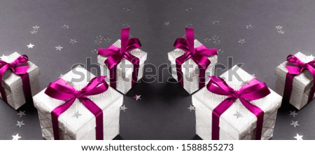 Gift box ribbon. Christmas gifts, red decor on black background. Xmas present. Winter holiday concept. New Year. Noel.