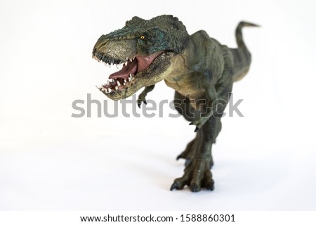 Portrait of a walking tyrannosaurus rex with open mouth isolated on white background