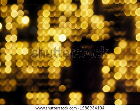 gold abstract blured background and white bokeh on black background.