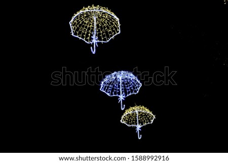 illuminated flying umbrellas, christmas decoration in the city.