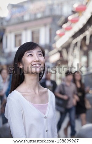 Portrait of young woman outdoors in Beijing