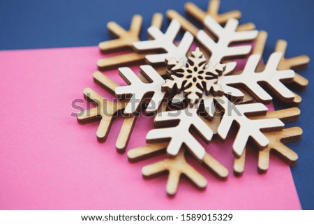 Handmade wooden snowflakes.Christmas toys in close up.Hand crafted rustic decorations made from ecological wood material.Winter holiday home decor 