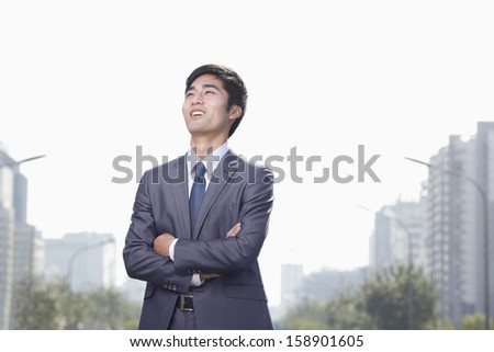 Young businessman looking away