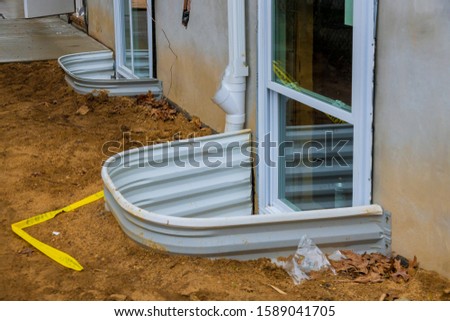 New residential home building materials window well for basement construction Royalty-Free Stock Photo #1589041705